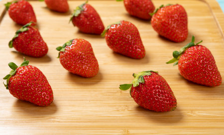 angle view fresh strawberries on wood backgroundの写真素材