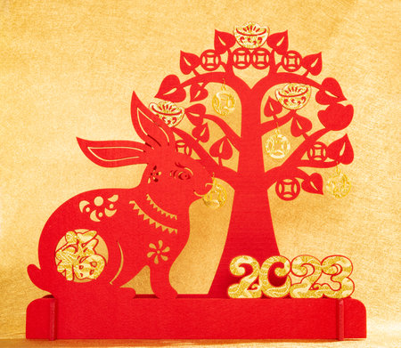Chinese New Year of Rabbit mascot with cash cow on gold background the Chinese word means fortuneの写真素材