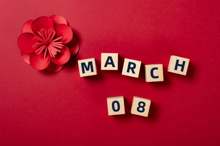 MARCH 08 and gift box on red horizontal composition concept for international womens day