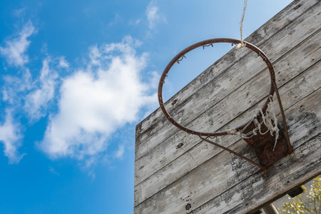 angle view basketball hoop and board under the blue sky horizontal compositionの写真素材