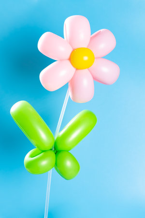 flower shape balloons on a blue backgroundの写真素材