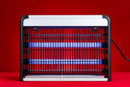 electric indoor mosquito and insect killer on redの写真素材