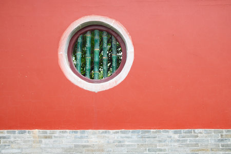 round shape window on a red wallの写真素材