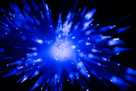 blue optical fibre in dark selective focus and kinda looks like coronavirus