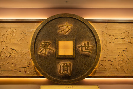 Taiyuan ShanXi China-July 29 2023:coin shape object in the Shanxi Museum.のeditorial素材