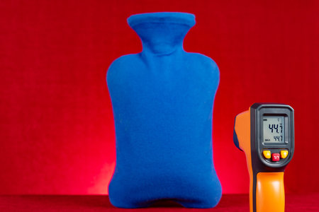 infrared thermometer shows the surface temperature of a hot water bottle