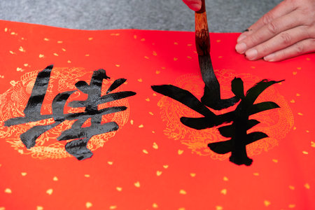 writing Chinese new year scrolls translation of the characters are new yearの写真素材