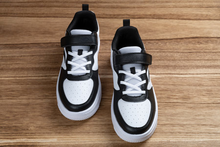 pair of black and white sporty shoes for kid