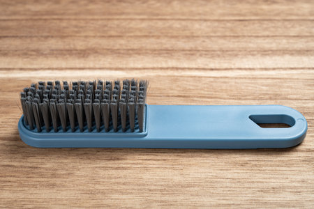 angle view cleaning brush on wood background