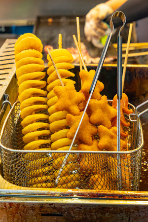 deep fried Tornado potato and other food stuffs at vertical compositionの写真素材