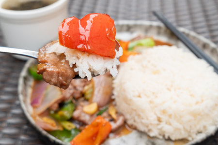 angle view beef with sweet pepper and onion and rice and soup at horizontal compositionの写真素材