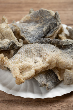 angle view ready-to-eat grilled fish skin at vertical composition