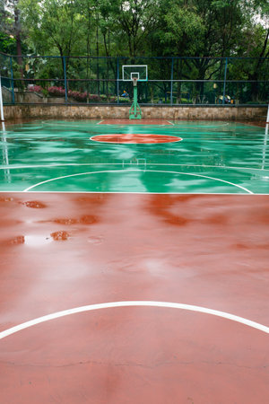 an outdoor basketball court after the rain at vertical compositionの写真素材