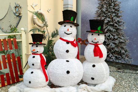 three big Christmas snowmen in the outdoor at horizontal compositionの写真素材