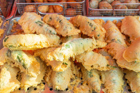 street stall sells deep fried chili peppersの写真素材