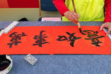 writing Chinese new year scrolls translation of the characters are all wishes come trueの写真素材