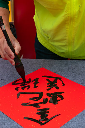 writing Chinese new year scrolls translation of the characters are The Golden Snake Brings Good Fortuneの写真素材