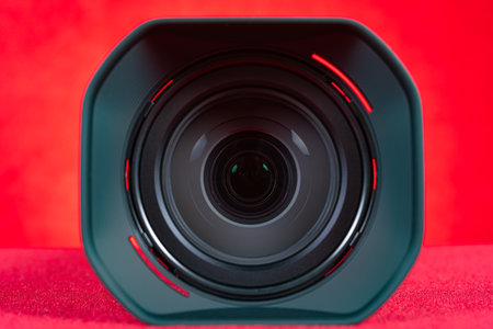 a camera lens on a red backgroundの写真素材