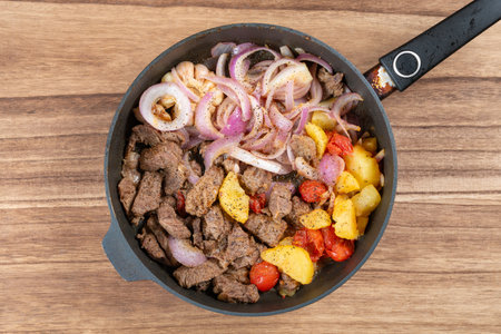 top view fresh home cooked beef dices on a panの写真素材