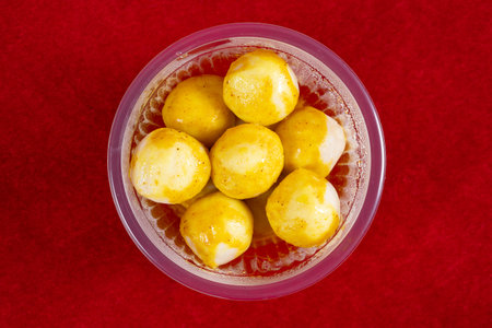 top view golden curry flavor fish balls on redの写真素材