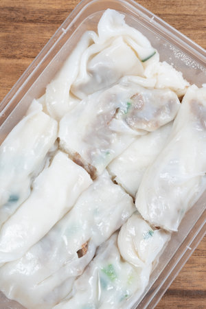 top view box of traditonal Cantonese food of beef cheong fun or rice noodle rolls or steamed vermicelli rolls vertical compositionの写真素材