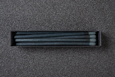 top view black matchbox on a black background