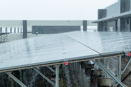 solar panels in heavy rain at horizontal compositionの写真素材
