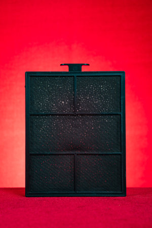 square shape air filter on a red backgroundの写真素材