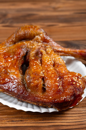 angle view honey-glazed roast duck leg at vertical compositionの写真素材