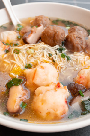 angle view bowl of ChaoZhou beef offal and various seafood ingredients at vertical compositionの写真素材