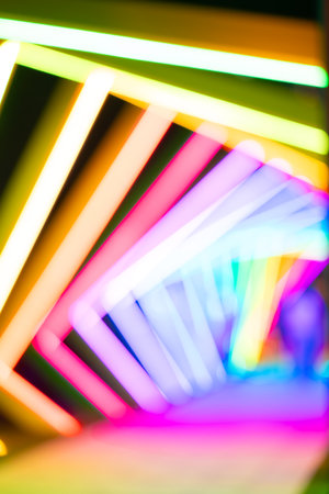 out-of-focus colorful light trails at vertical composition as background