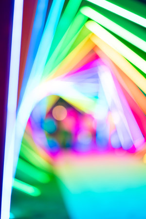 out-of-focus colorful light trails at vertical composition as background