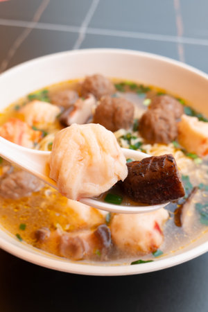 angle view bowl of ChaoZhou beef offal and various seafood ingredients at vertical compositionの写真素材