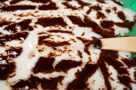 angle view melted chocolate outer with milk and blueberry flavors popsicleの写真素材