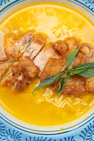 top view sour soup noodles with chicken at vertical composition