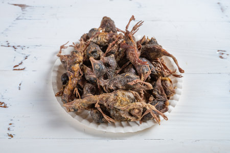 angle view dish of freeze-dried quails at cats treats at horizontal compositoin