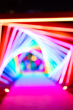 out-of-focus colorful light trails at vertical composition as backgroundの写真素材