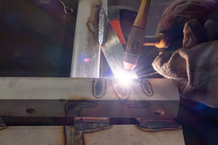 worker welding in a factory