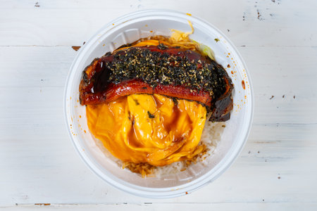 top view bowl of grilled eel with fluffy egg over rice at horizontal compositionの写真素材