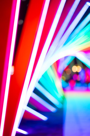 out-of-focus colorful light trails at vertical composition as backgroundの写真素材