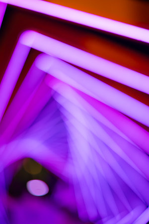 out-of-focus colorful light trails at vertical composition as backgroundの写真素材