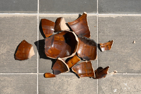 top view broken clay pot on the floorの写真素材