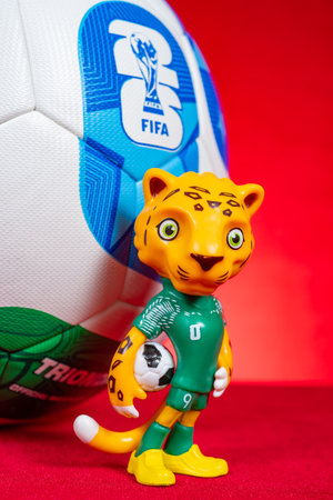 ZHONGSHAN China-November 16 2025: mascot Zayu and the soccer for the 2026 FIFA World Cup on red at...