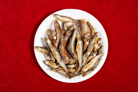 top view dish of dried fish snacks at horizontal composition