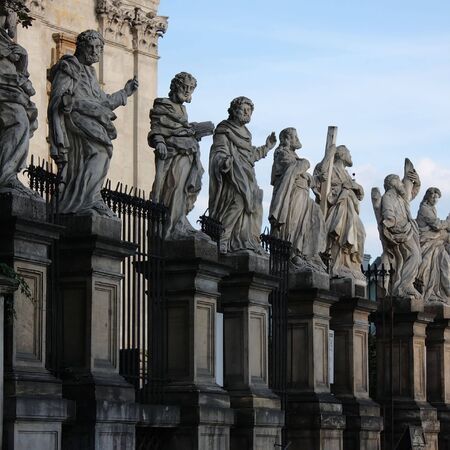 A side view of the statues of the 12 apostles in front of the St's. Peter and Paul's church in Krakow, Poland.の写真素材