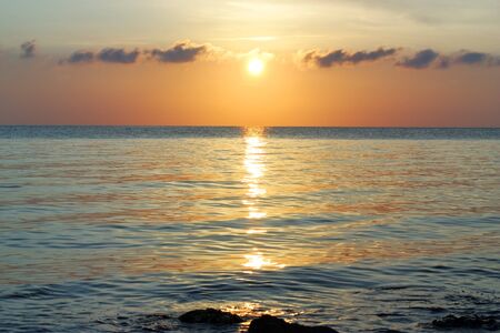 Beautiful sunrise over the ocean の写真素材