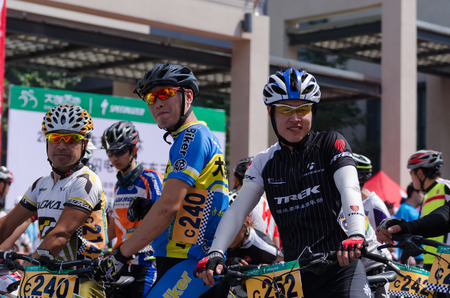 Dalian, China - July 15 Professional bicycling racers takes their position on the starting line for the bike road race  on July 15, 2014 in Dalian のeditorial素材