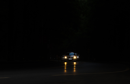 Cars are running on the avenue in the night, the lights shinning like a jewel.の写真素材