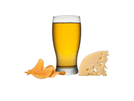 Glass of beer with crisps and cheese, isolated on a white backgroundの写真素材