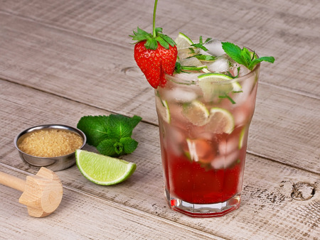 Strawberry mojito cocktail over wooden backgroundの写真素材